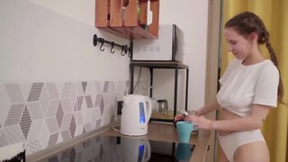 Russian bombshell with natural tits masturbates in the kitchen